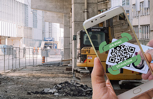 Workers clocking in on a construction site with QR codes